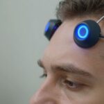 Person receiving advanced depression treatment with TMS device.